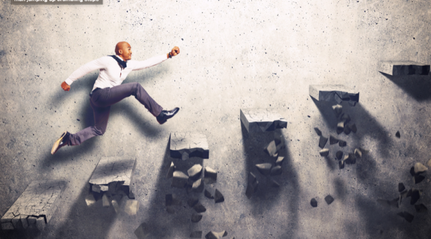 man jumping up crumbling steps